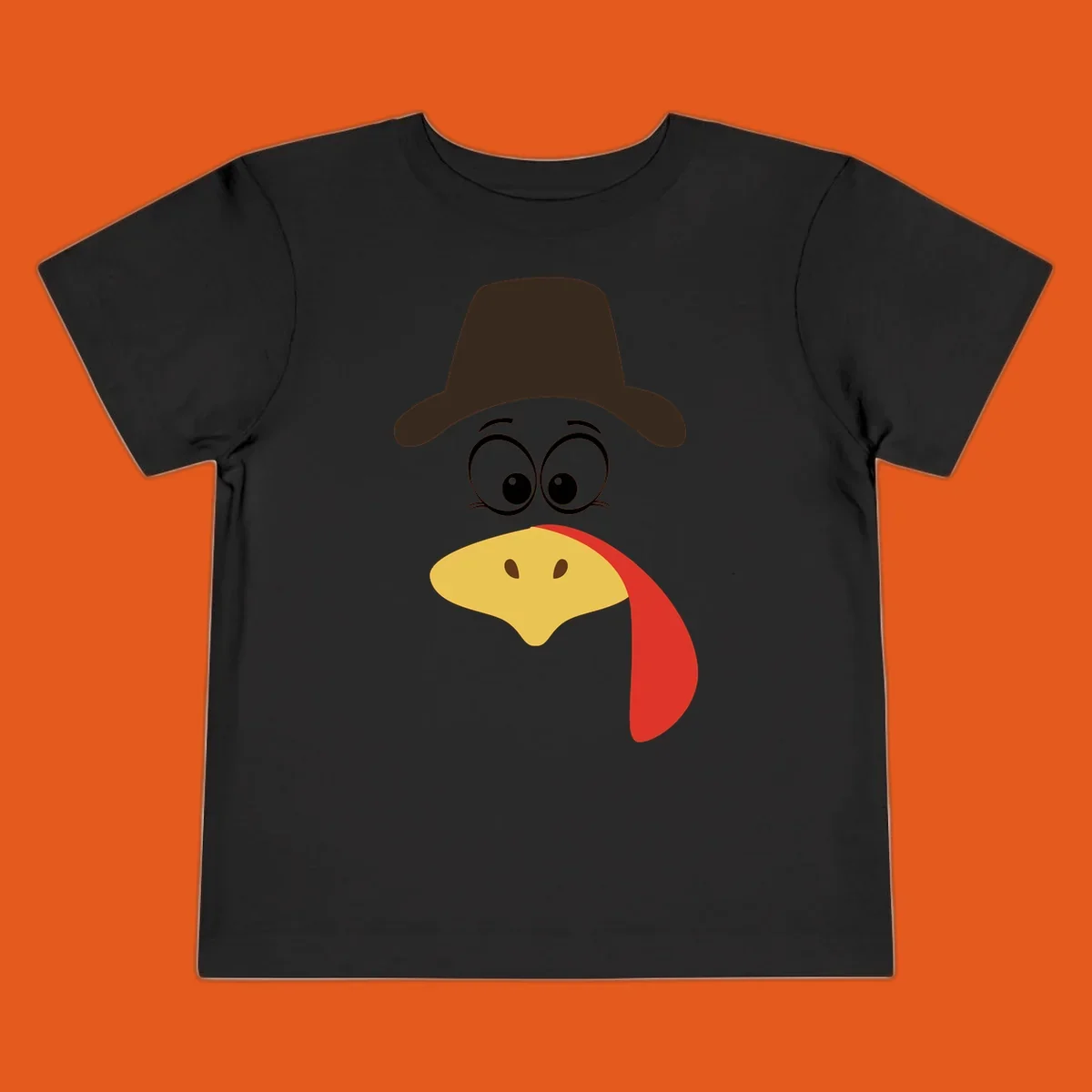 Cartoon turkey face wearing a cowboy hat, graphic for Turkey Trot runs.