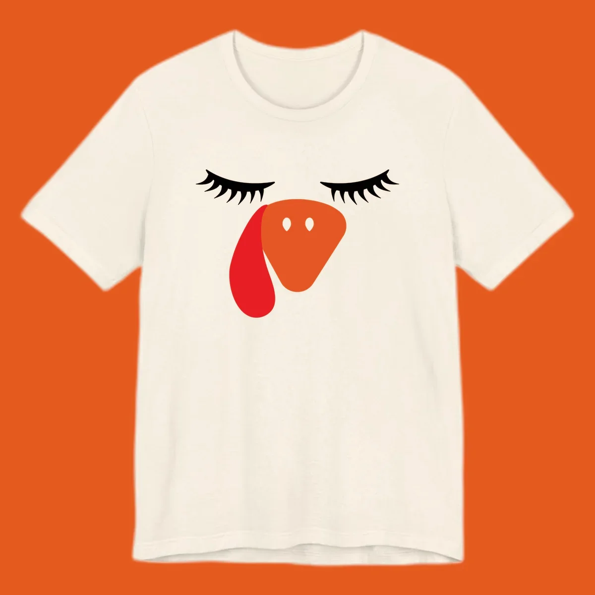 Funny turkey face graphic with closed eyes and eyelashes, perfect for Turkey Trot shirts.