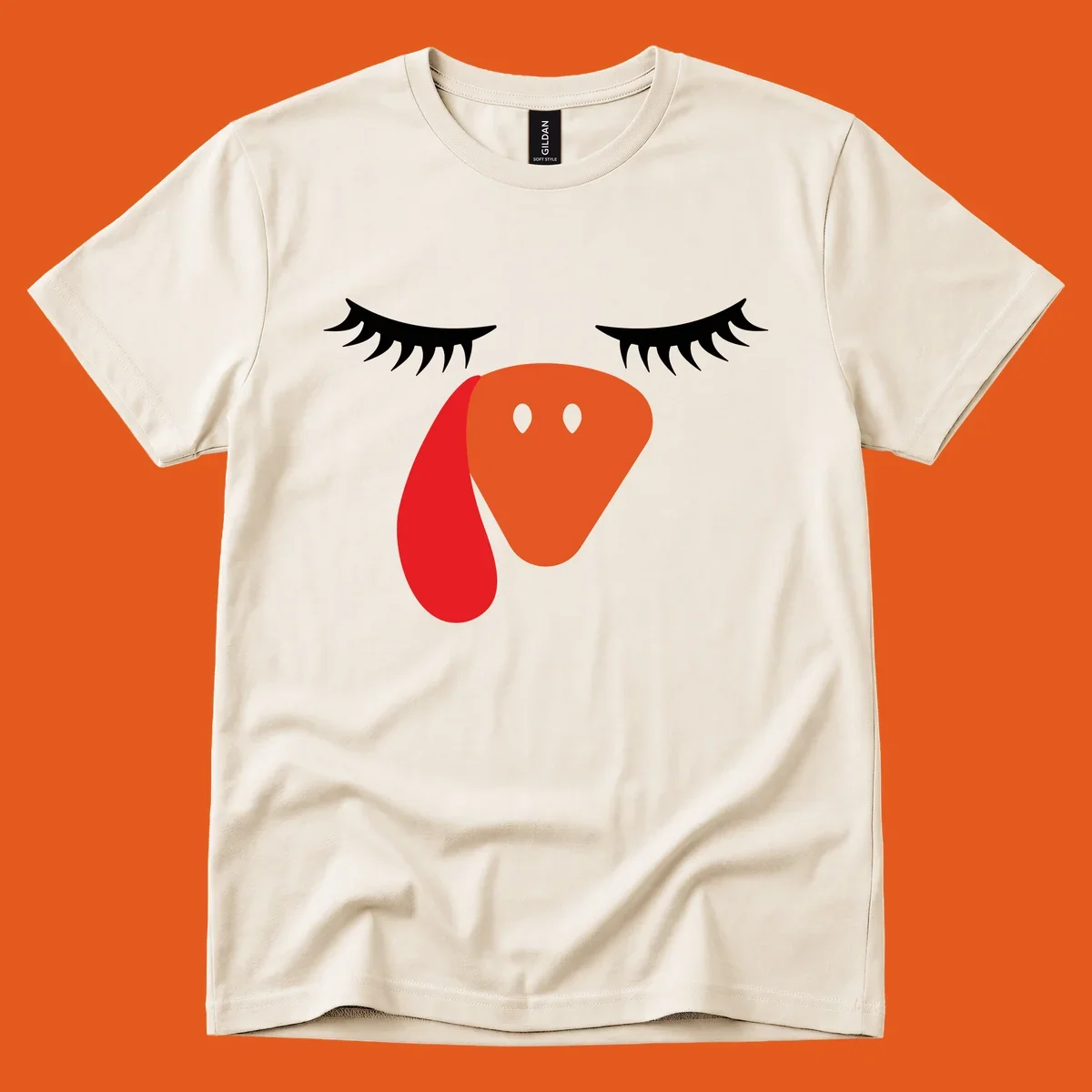Funny turkey face graphic with closed eyes and eyelashes, perfect for Turkey Trot shirts.