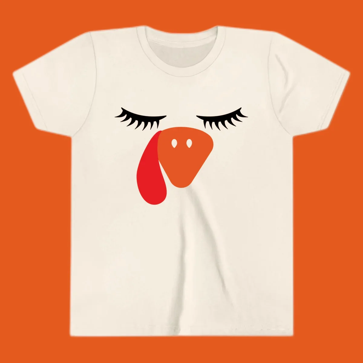 Funny turkey face graphic with closed eyes and eyelashes, perfect for Turkey Trot shirts.