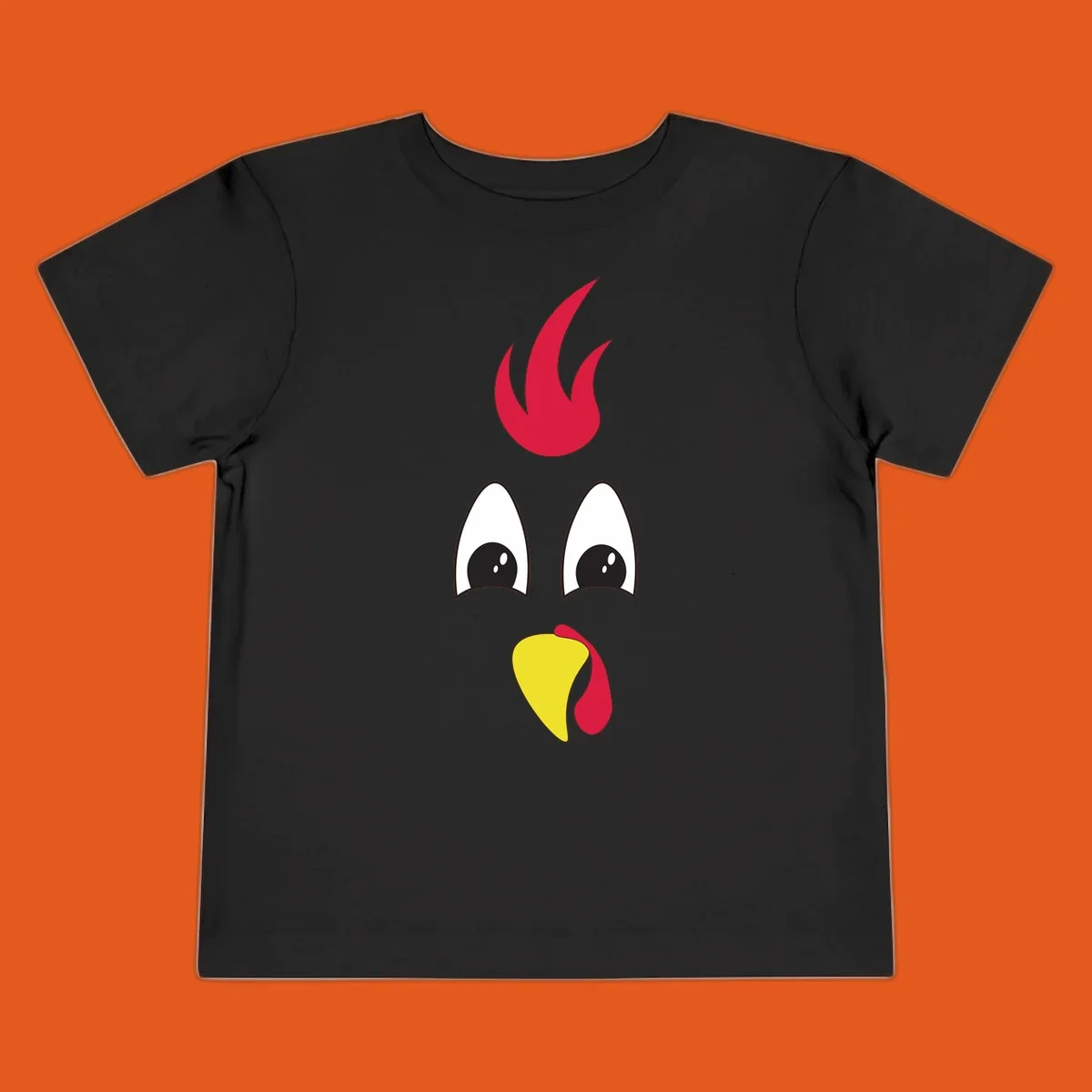Rooster face graphic for Turkey Trot runners, featuring a red comb and yellow beak.