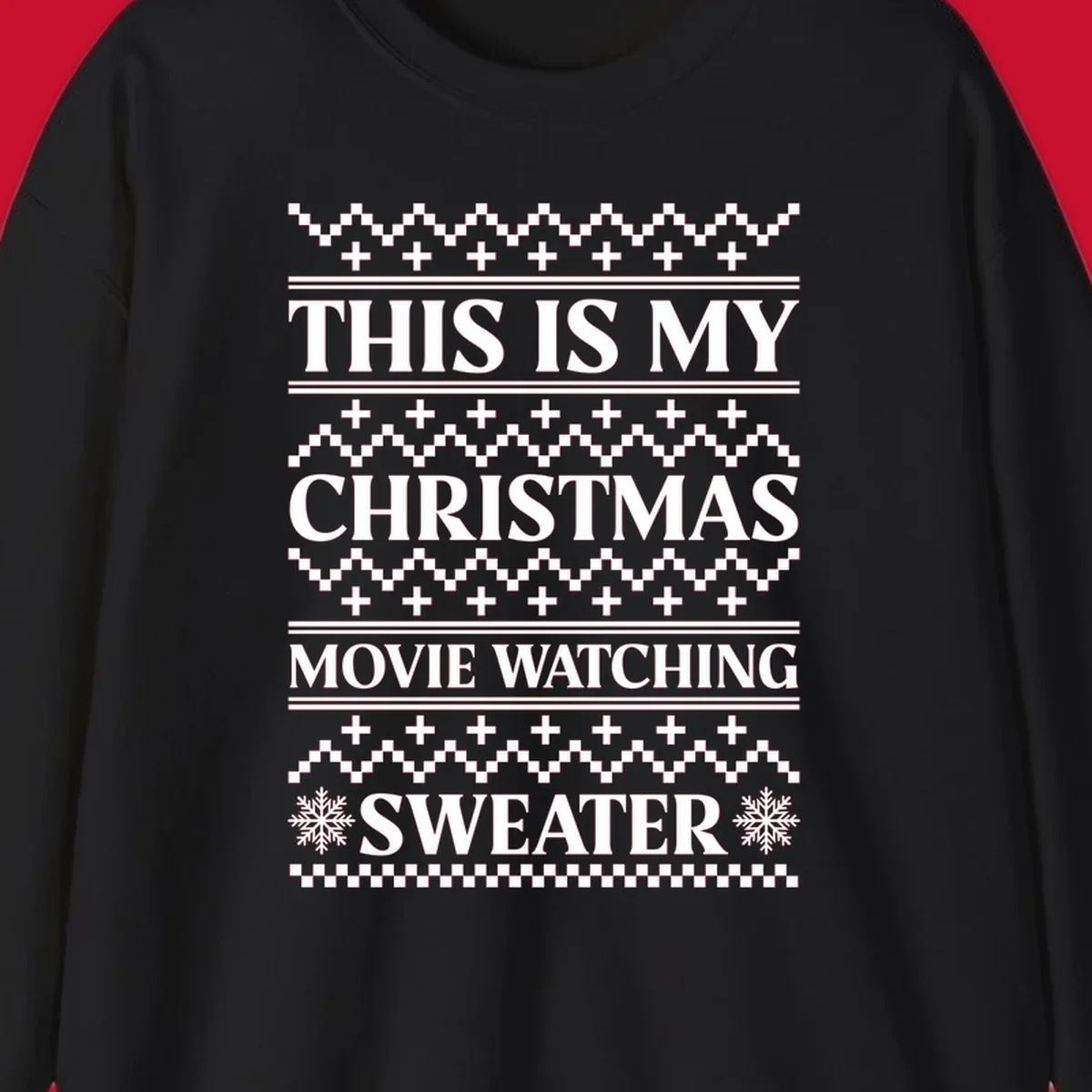 Christmas movie watching sweater with bold text and festive patterns.