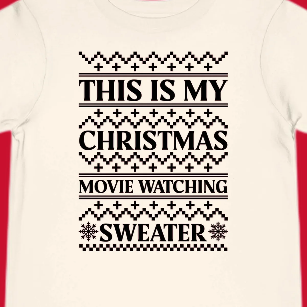 Christmas movie watching sweater with bold text and festive patterns.