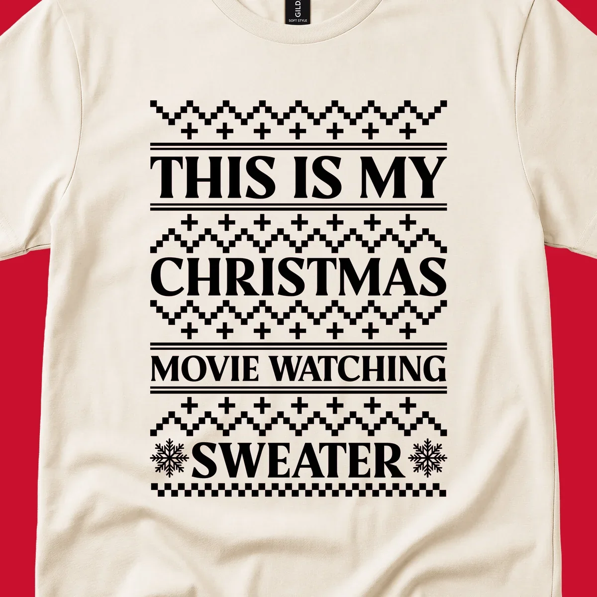 Christmas movie watching sweater with bold text and festive patterns.