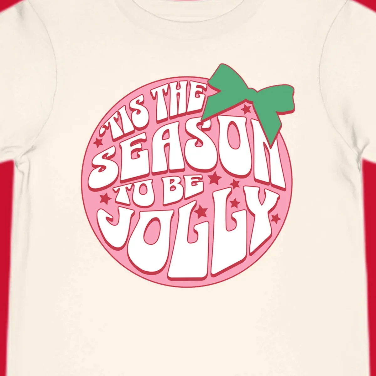 Tis the season to be jolly text with bow and stars, pink oval