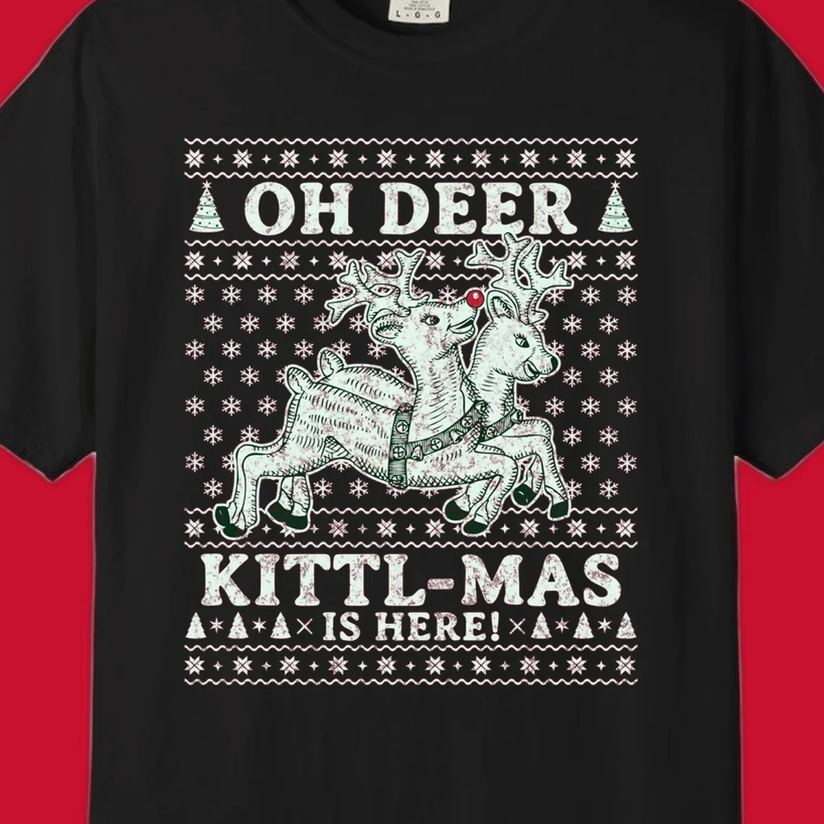 Oh Deer Kittl-Mas reindeer illustration with snowflakes and Christmas trees.
