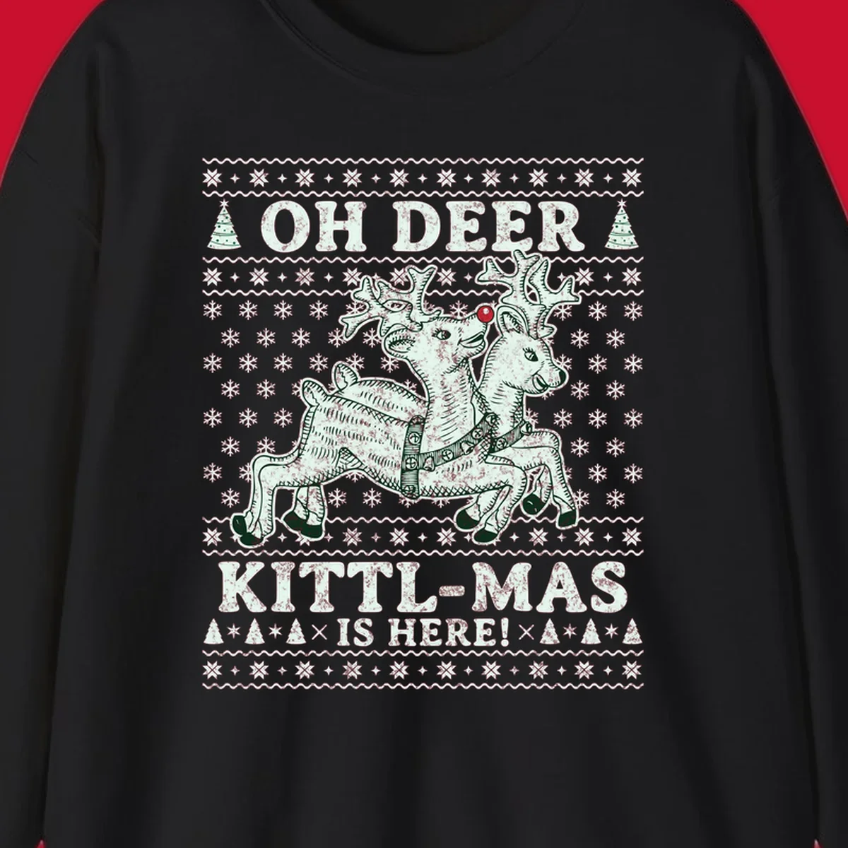 Oh Deer Kittl-Mas reindeer illustration with snowflakes and Christmas trees.