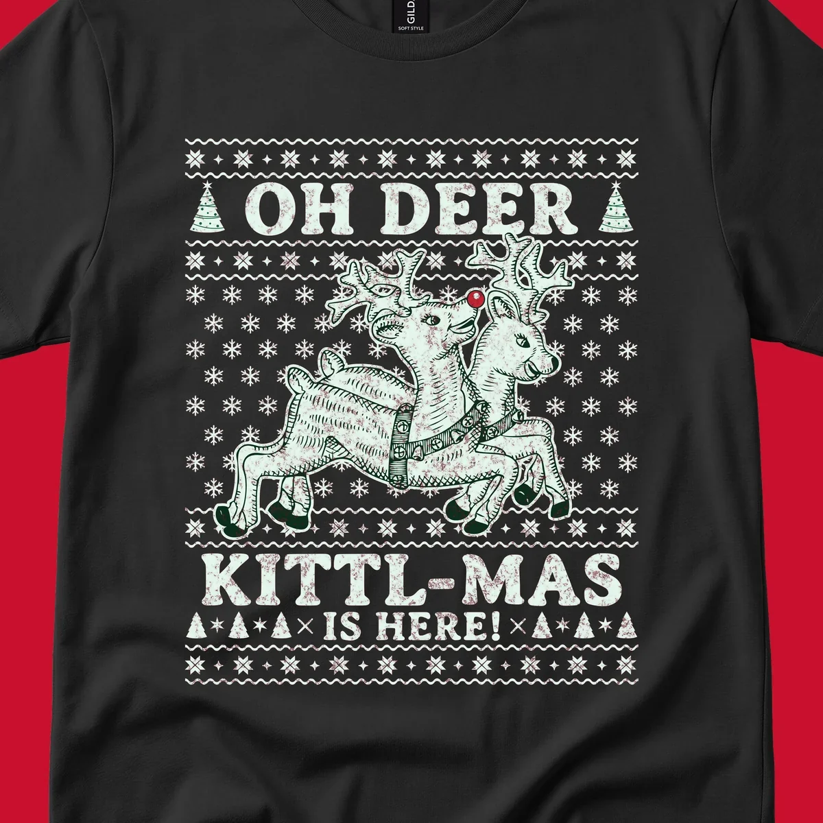Oh Deer Kittl-Mas reindeer illustration with snowflakes and Christmas trees.