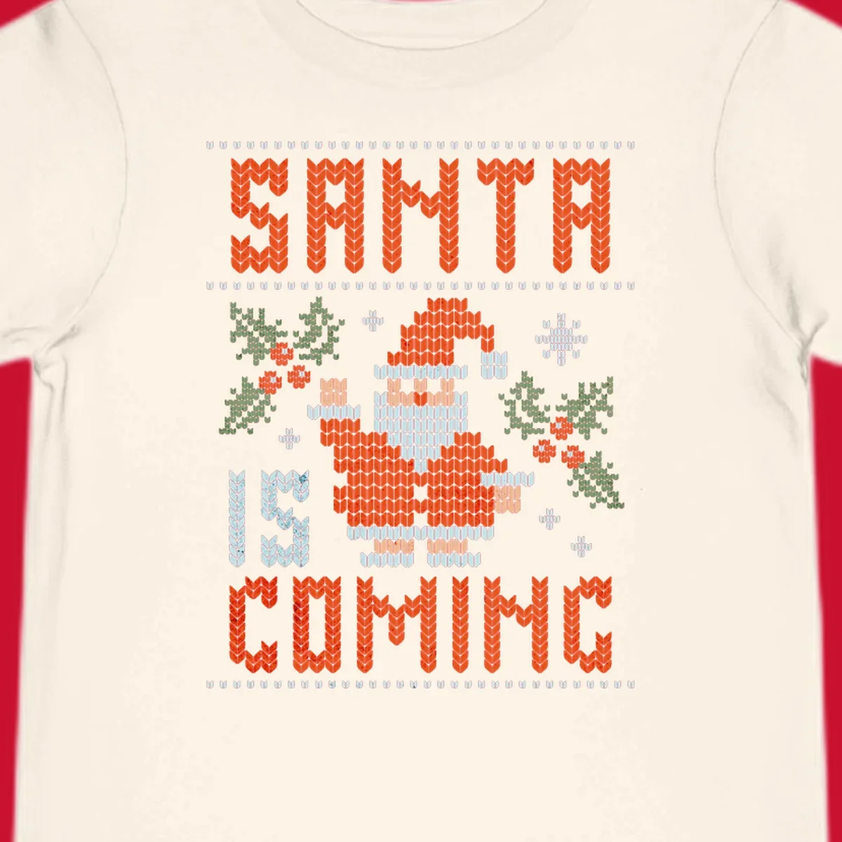 Santa is coming ugly Christmas sweater with pixelated Santa, holly, and snowflakes.