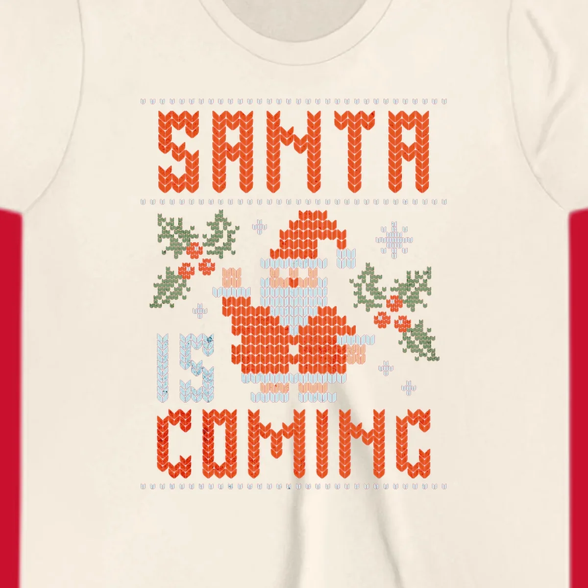 Santa is coming ugly Christmas sweater with pixelated Santa, holly, and snowflakes.