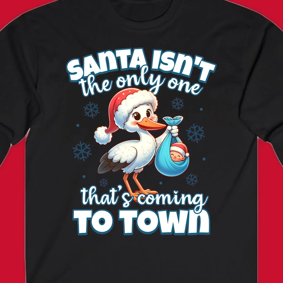 Stork carrying a baby with text "Santa Isn't The Only One That's Coming To Town".