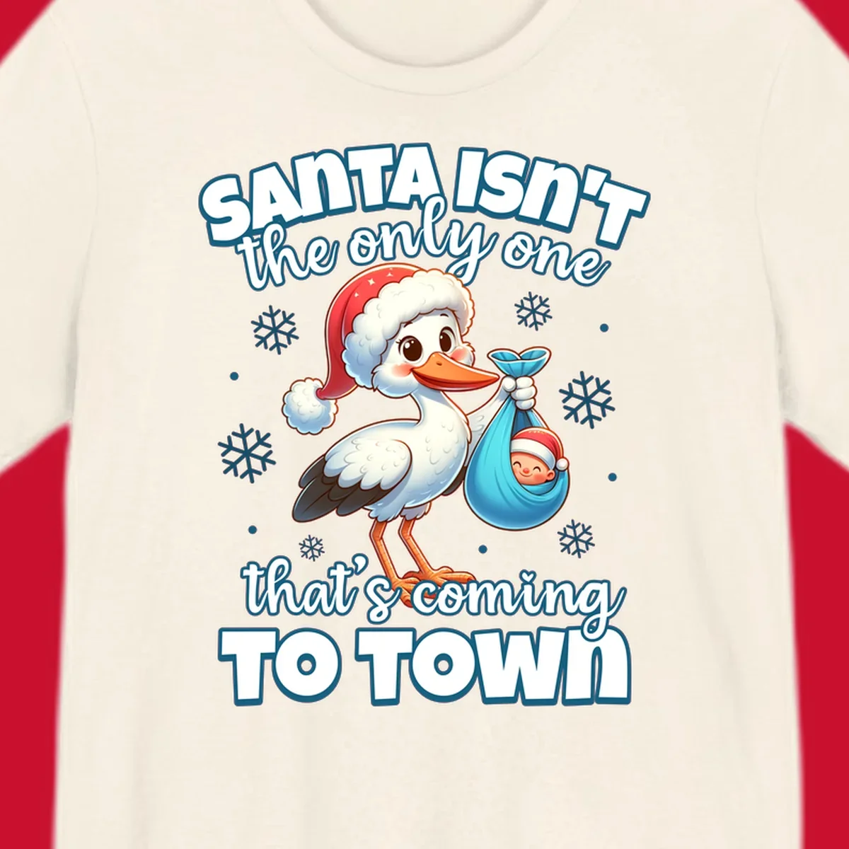 Stork carrying a baby with text "Santa Isn't The Only One That's Coming To Town".