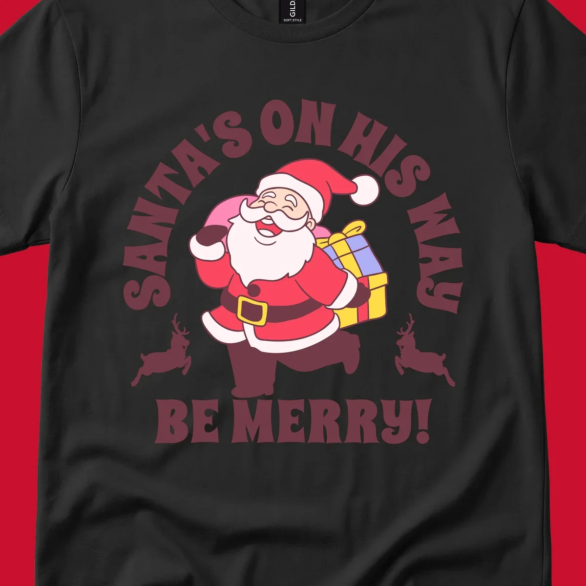 Illustration of Santa Claus running with gifts and reindeer, text reads Santa's on His Way Be Merry.