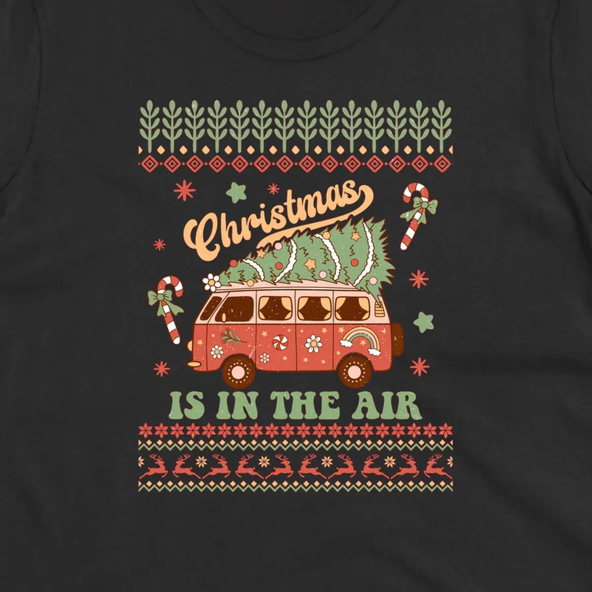 Retro Christmas van with tree on roof and 'Christmas IS IN THE AIR' text.