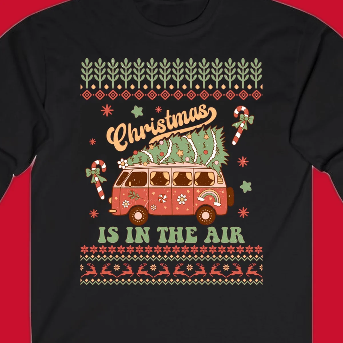 Retro Christmas van with tree on roof and 'Christmas IS IN THE AIR' text.