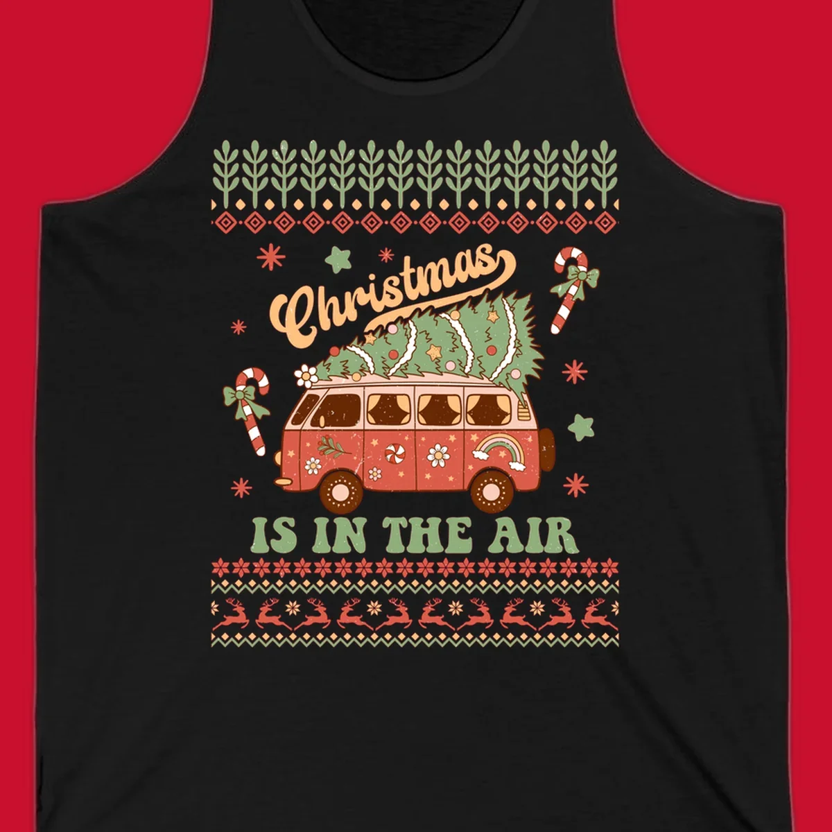 Retro Christmas van with tree on roof and 'Christmas IS IN THE AIR' text.