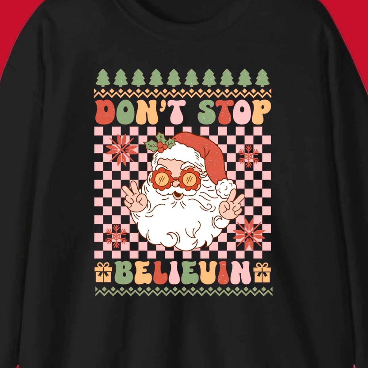 Retro Santa Claus with peace signs and sunglasses, text 'DON'T STOP BELIEVIN''.