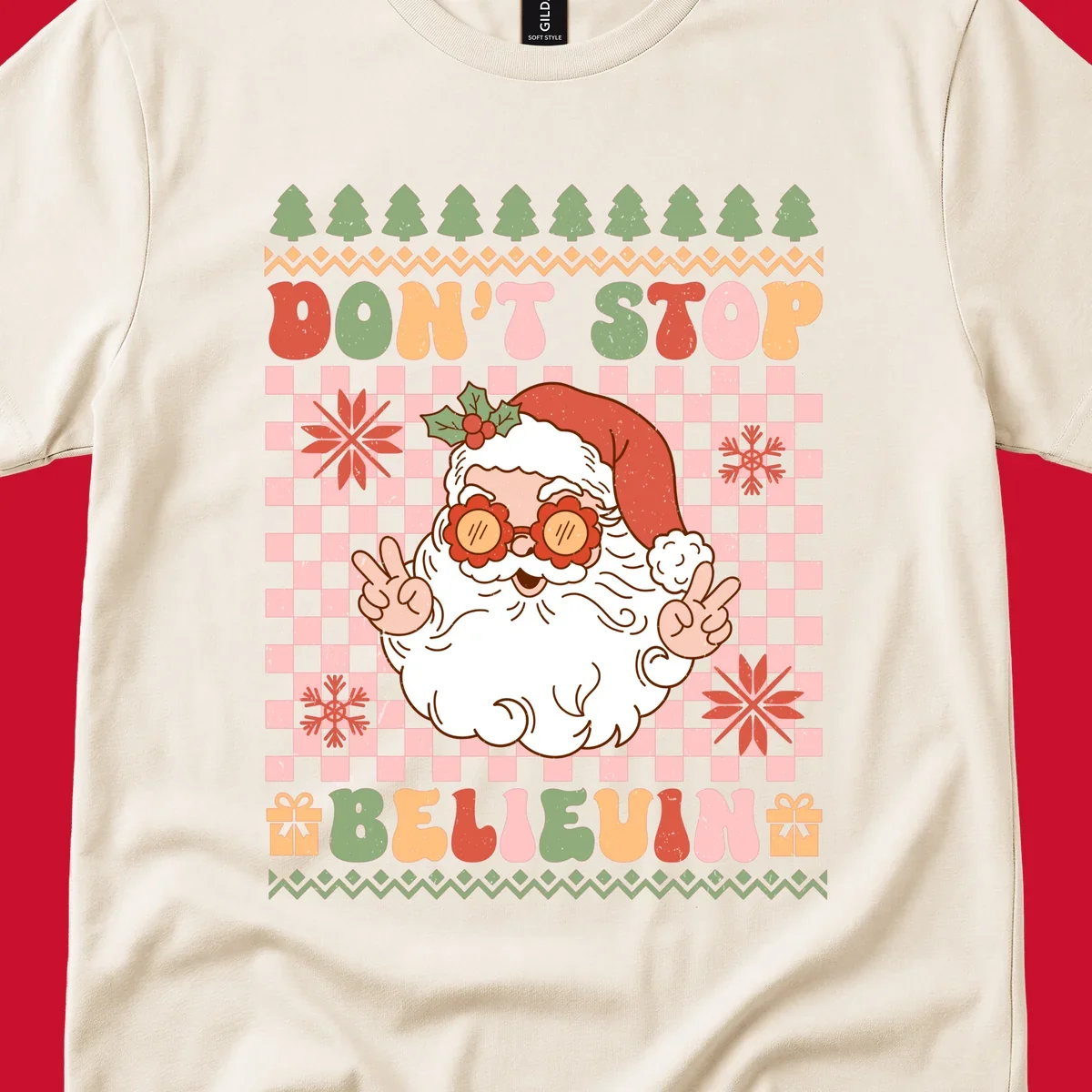 Retro Santa Claus with peace signs and sunglasses, text 'DON'T STOP BELIEVIN''.