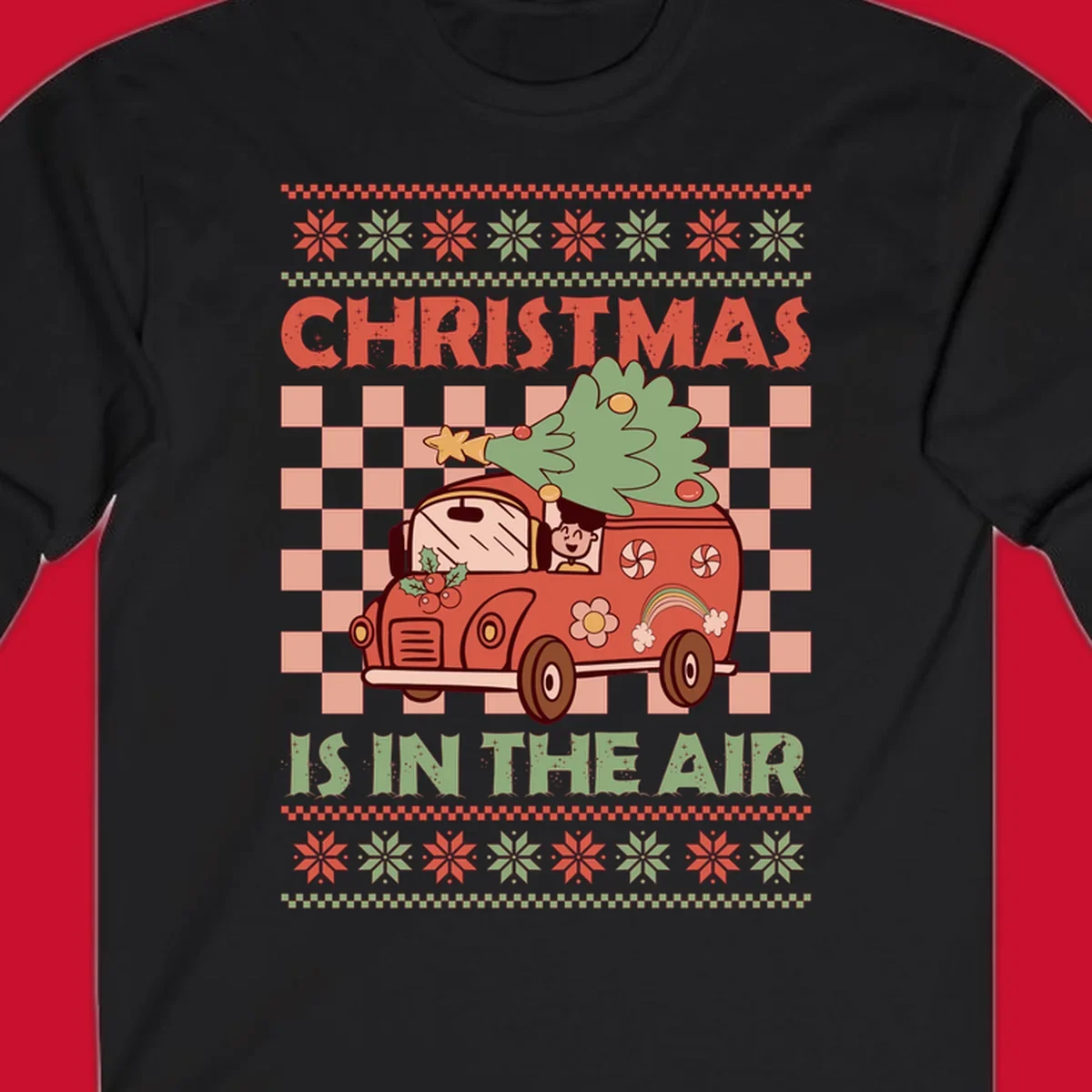 Christmas van with tree on top, text 'Christmas Is In The Air', snowflake borders, checkered pattern.