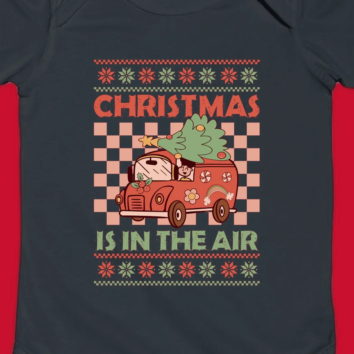 Christmas van with tree on top, text 'Christmas Is In The Air', snowflake borders, checkered pattern.