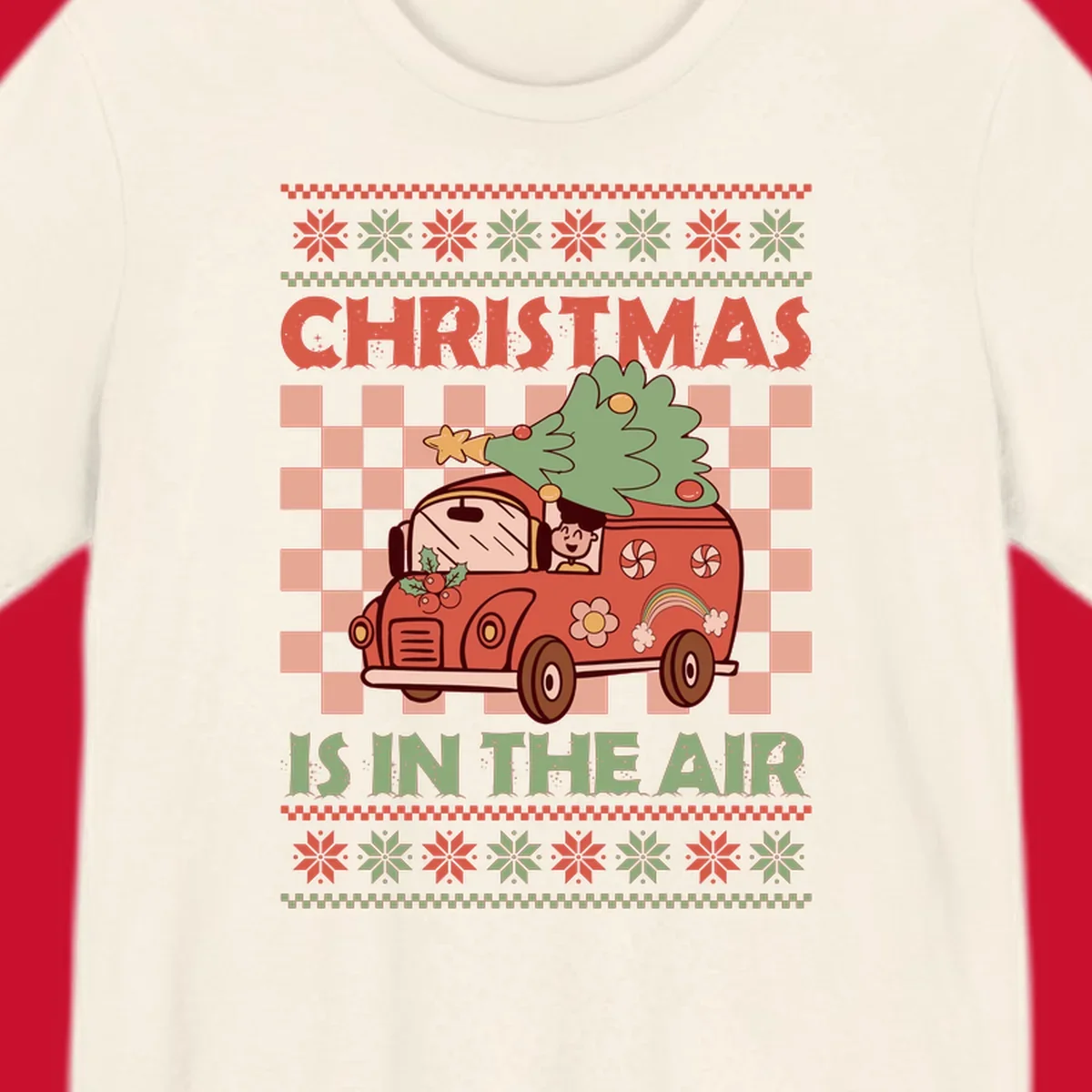 Christmas van with tree on top, text 'Christmas Is In The Air', snowflake borders, checkered pattern.
