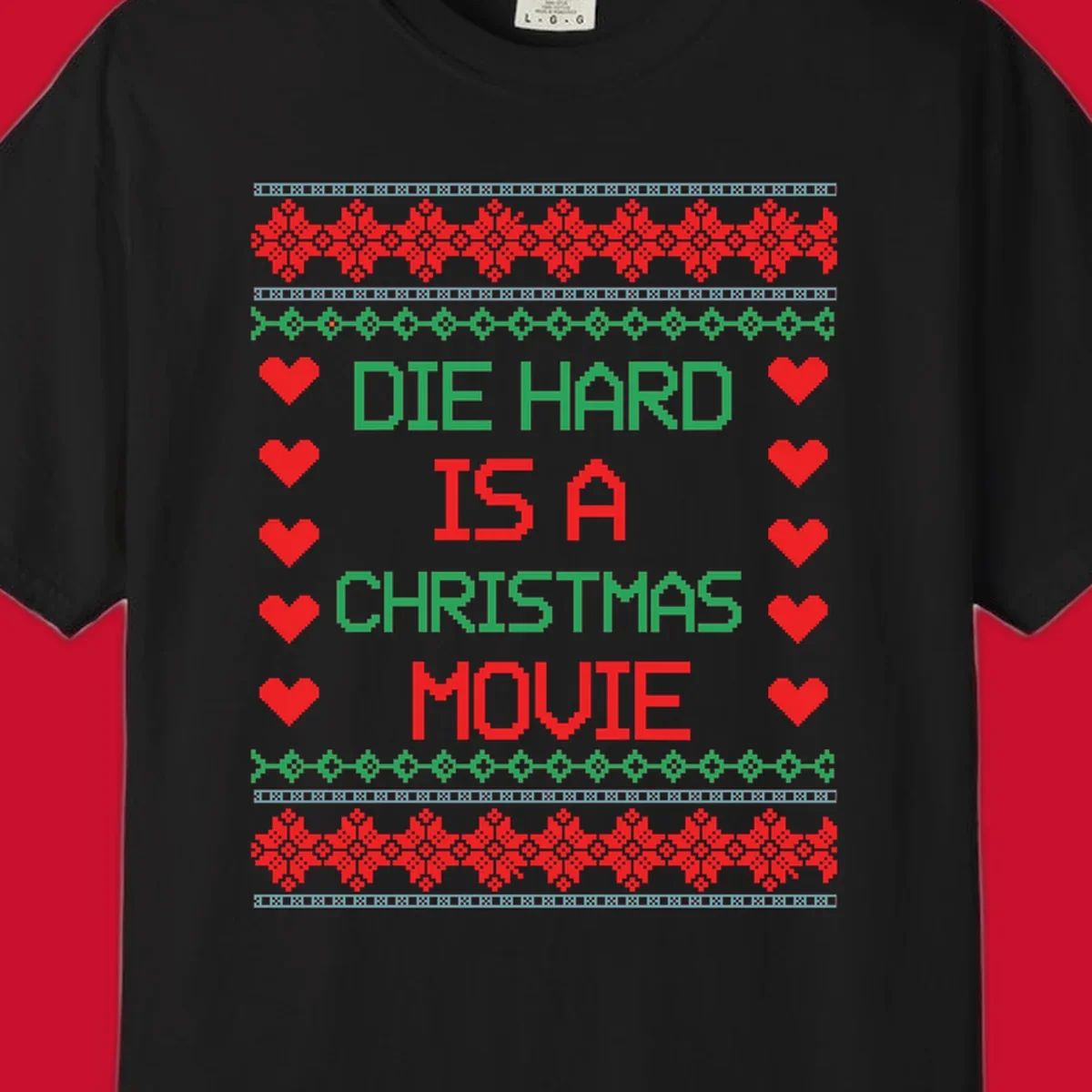 Die Hard is a Christmas Movie pixel art design with red hearts and holiday patterns.