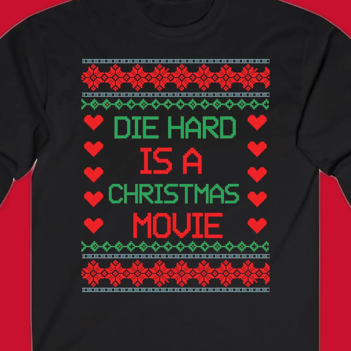 Die Hard is a Christmas Movie pixel art design with red hearts and holiday patterns.