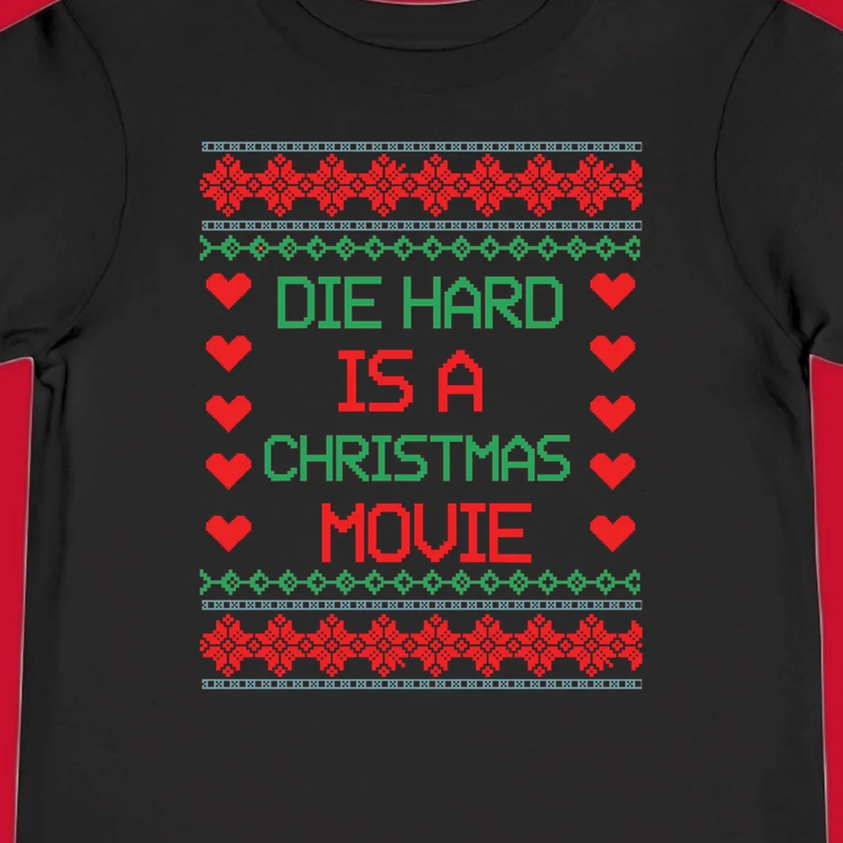 Die Hard is a Christmas Movie pixel art design with red hearts and holiday patterns.