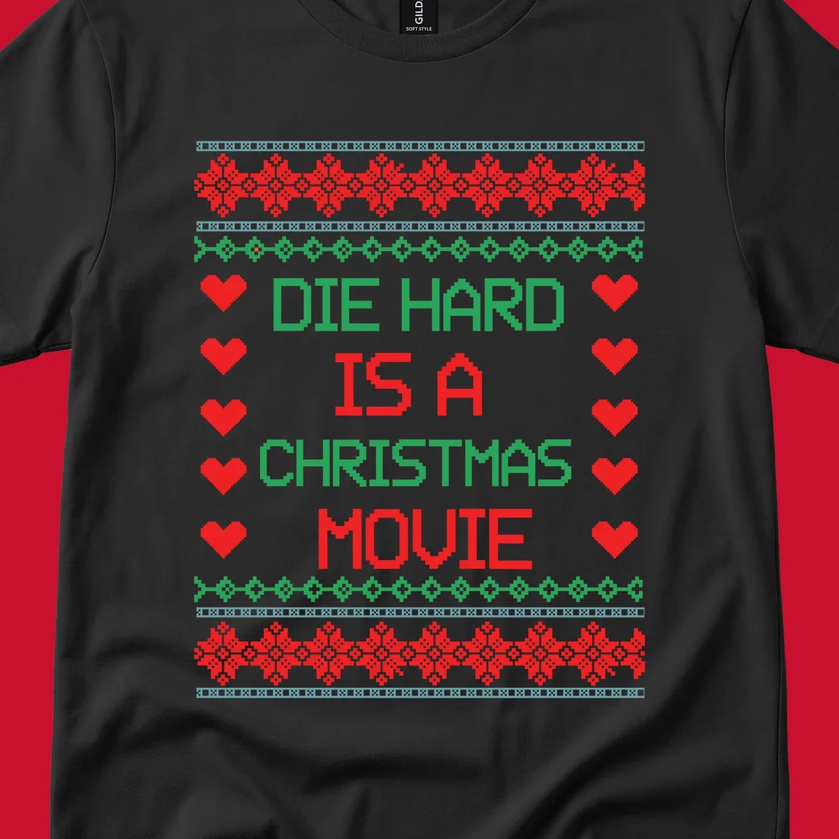 Die Hard is a Christmas Movie pixel art design with red hearts and holiday patterns.