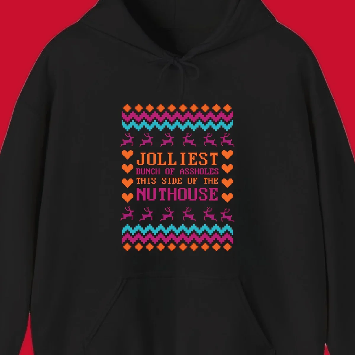 Jolliiest Bunch Of Assholes text with reindeer and heart graphics in an ugly sweater pattern.