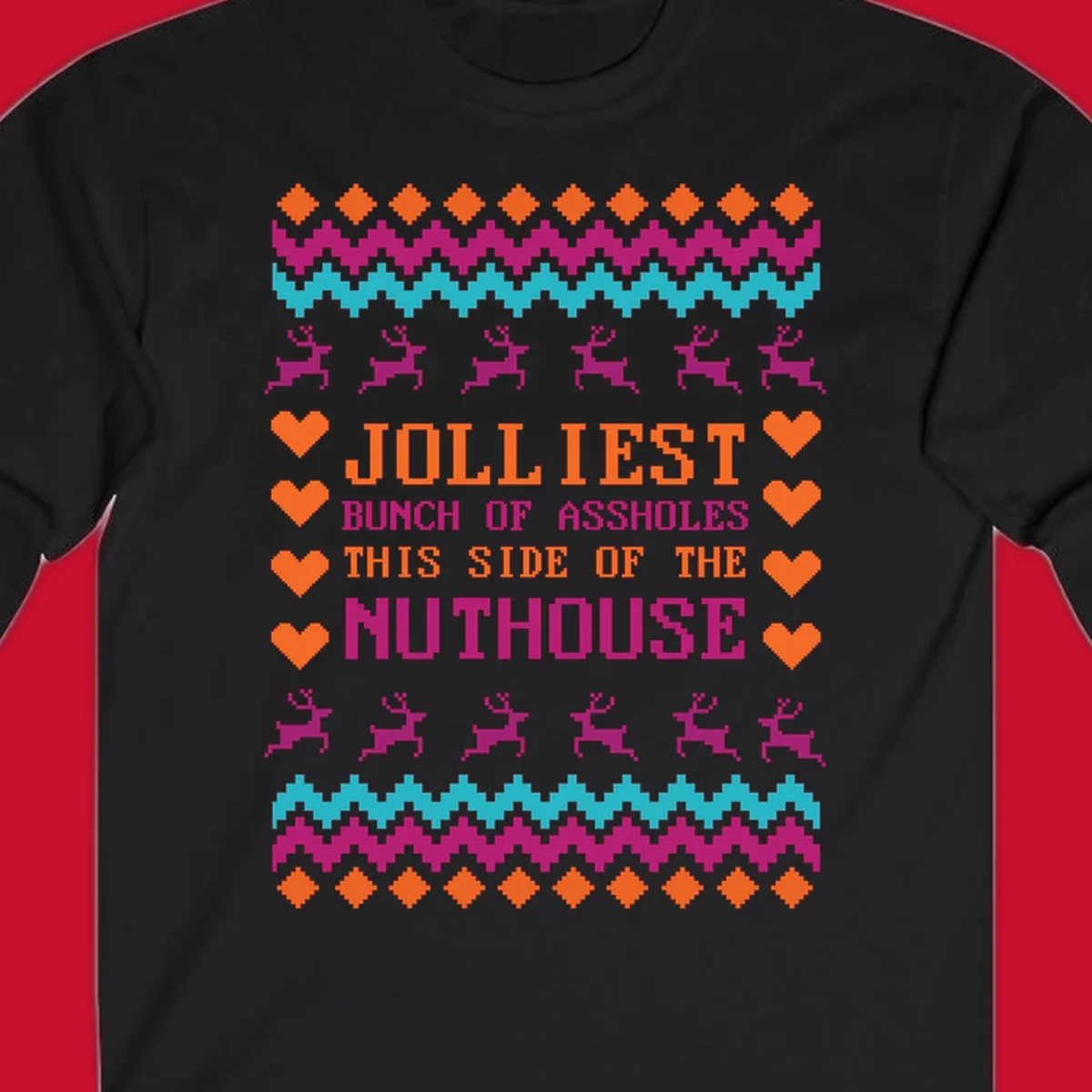 Jolliiest Bunch Of Assholes text with reindeer and heart graphics in an ugly sweater pattern.