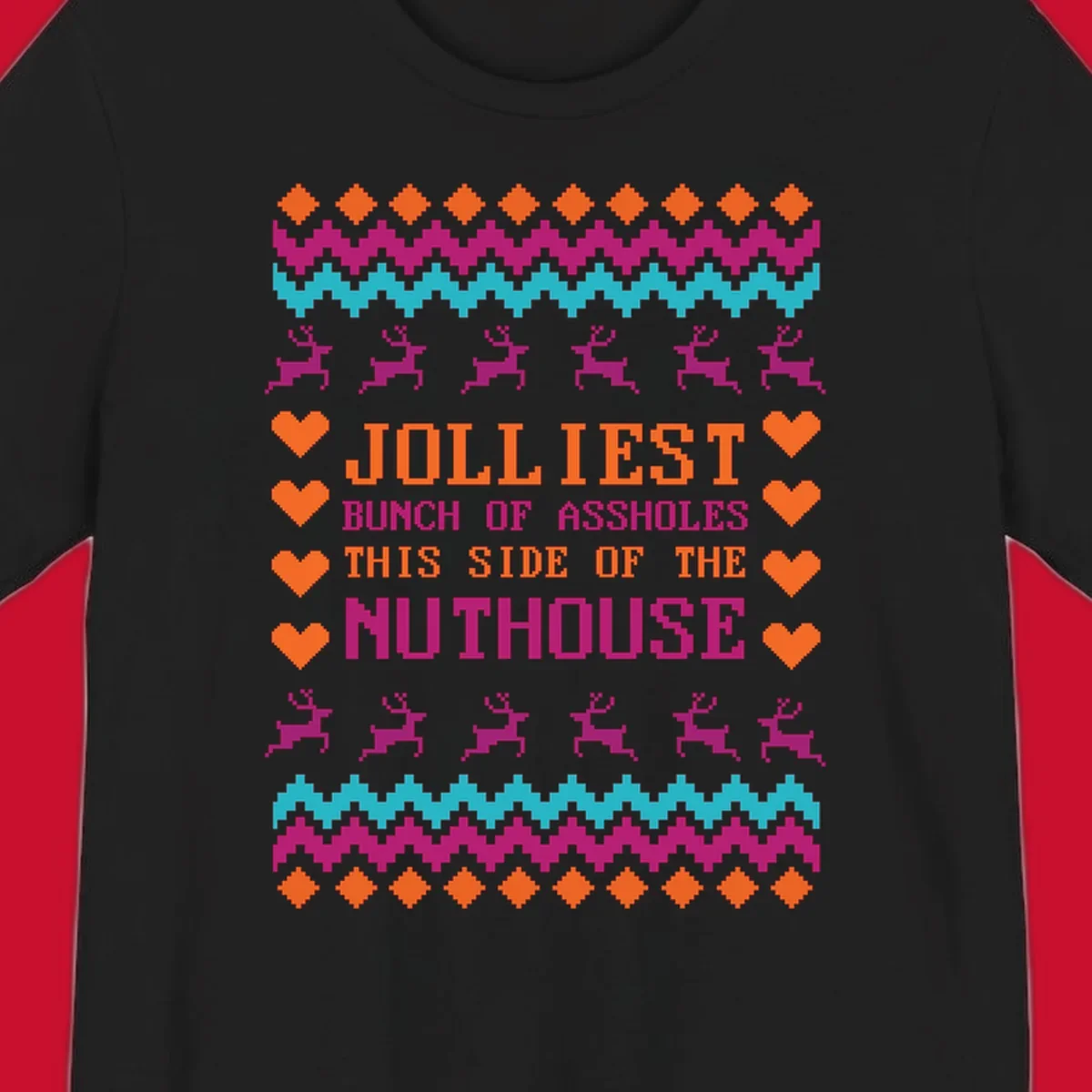 Jolliiest Bunch Of Assholes text with reindeer and heart graphics in an ugly sweater pattern.