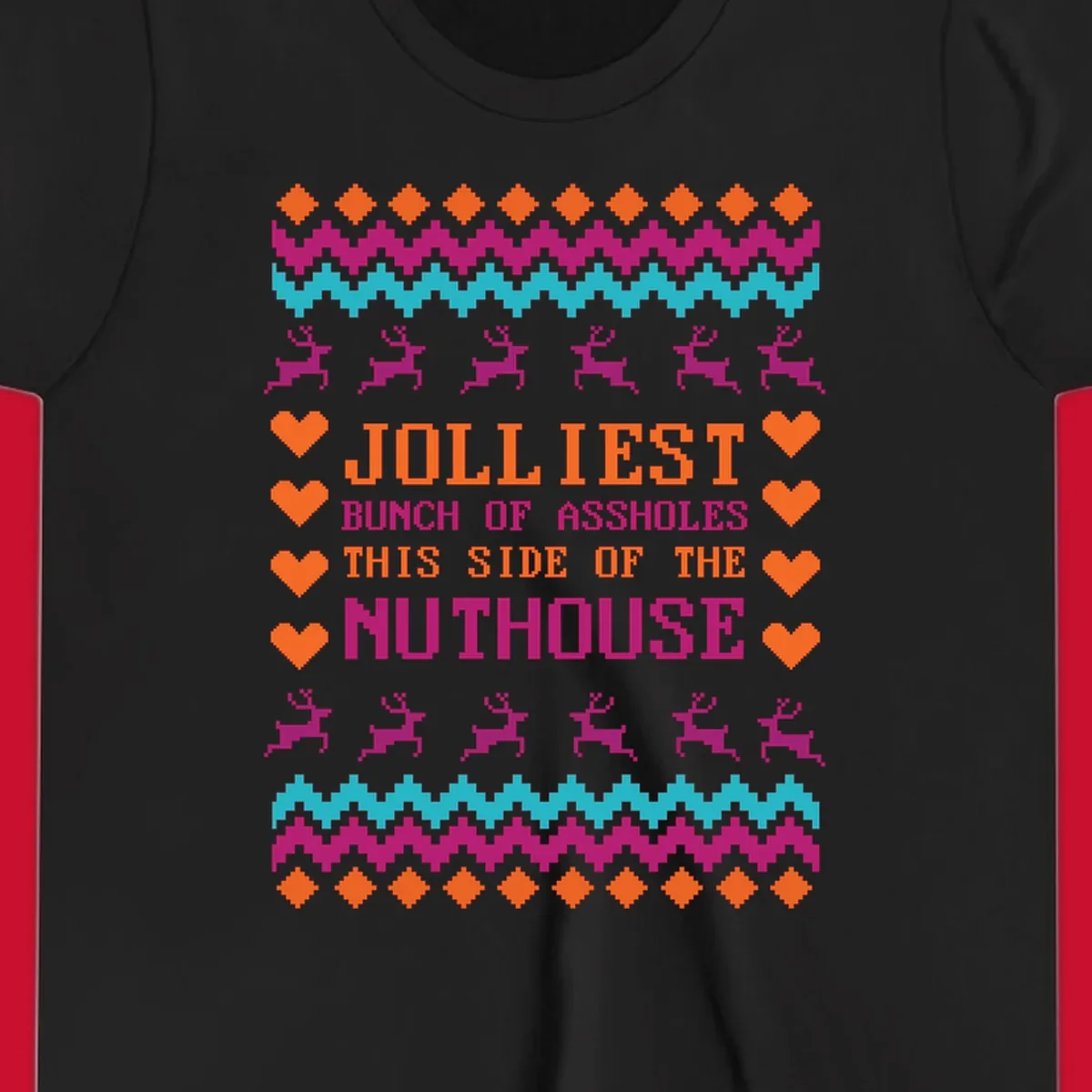 Jolliiest Bunch Of Assholes text with reindeer and heart graphics in an ugly sweater pattern.
