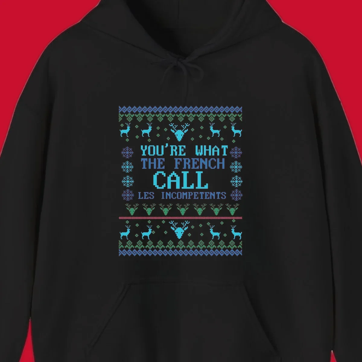 French Call Les Incompetents Ugly Christmas Sweater design with reindeer and snowflakes.