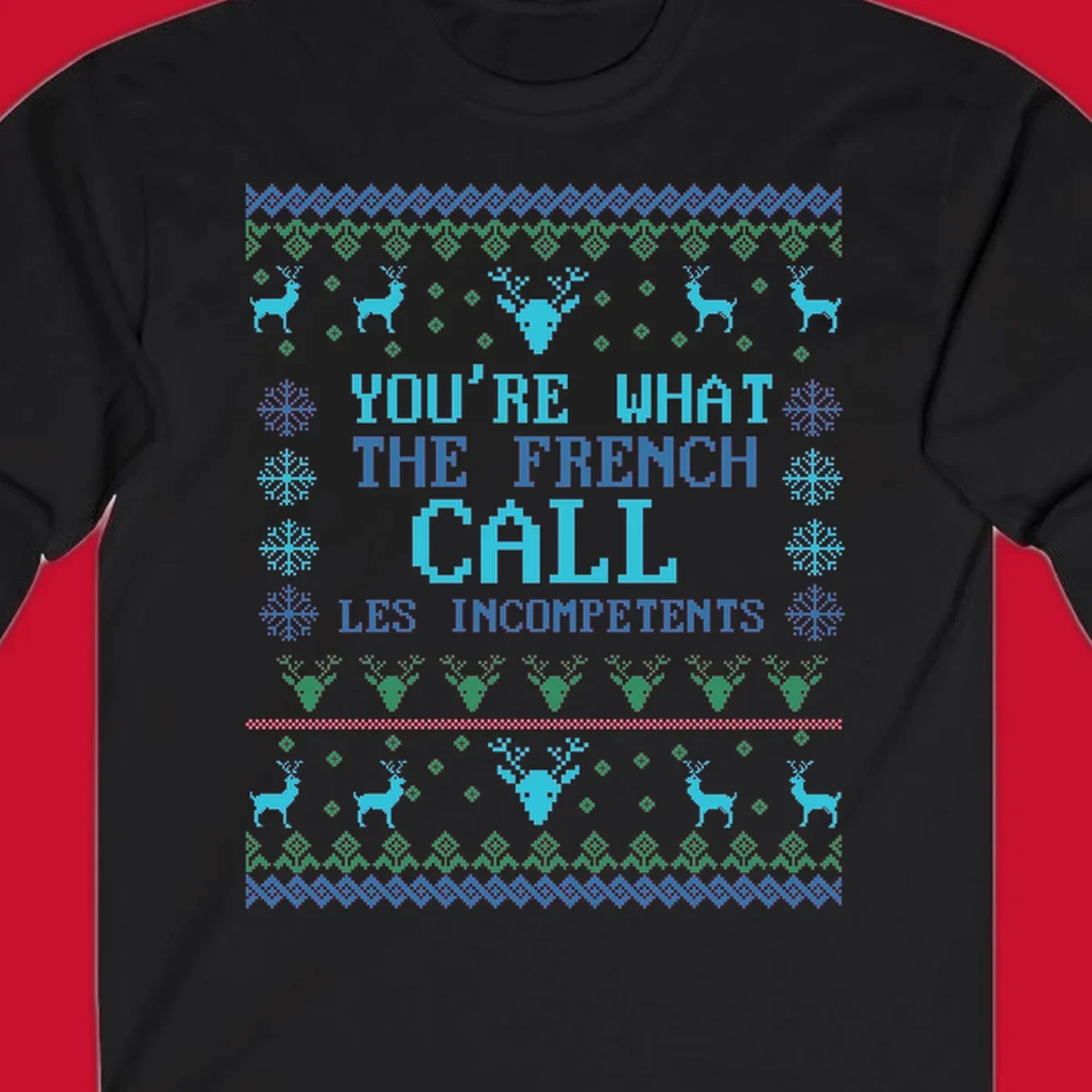 French Call Les Incompetents Ugly Christmas Sweater design with reindeer and snowflakes.