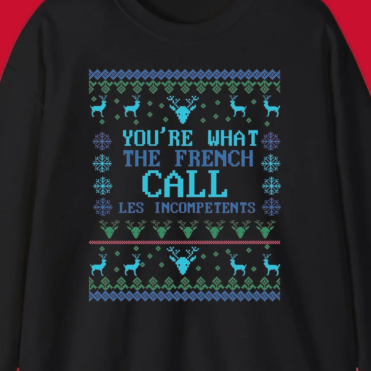 French Call Les Incompetents Ugly Christmas Sweater design with reindeer and snowflakes.