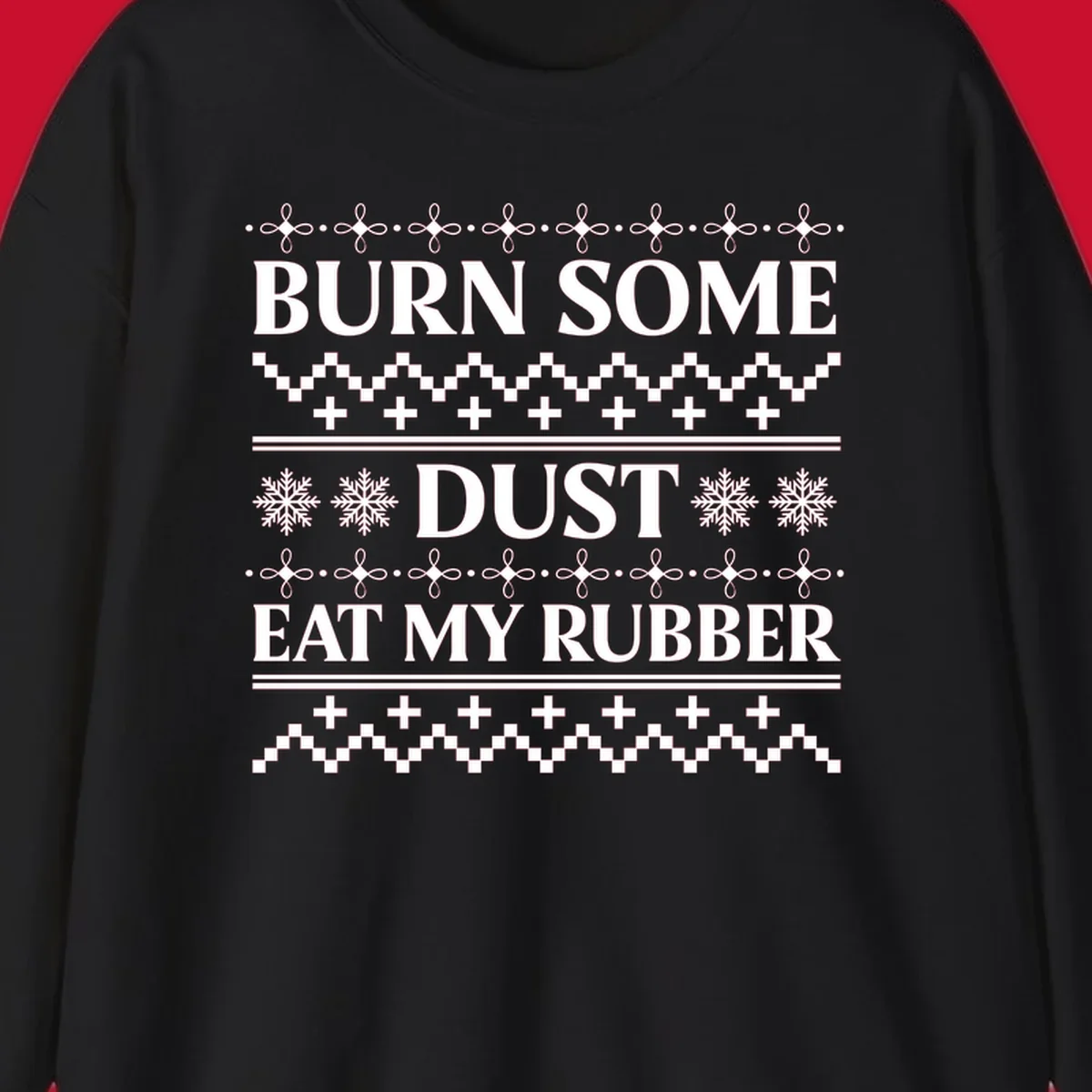 Burn some dust eat my rubber text with snowflakes and geometric patterns, an ugly christmas sweater design.