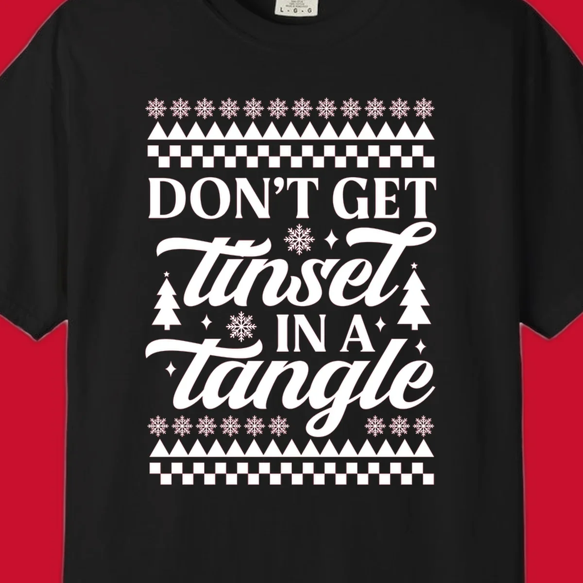 Don't Get Tinsel In A Tangle holiday design with snowflakes and trees.