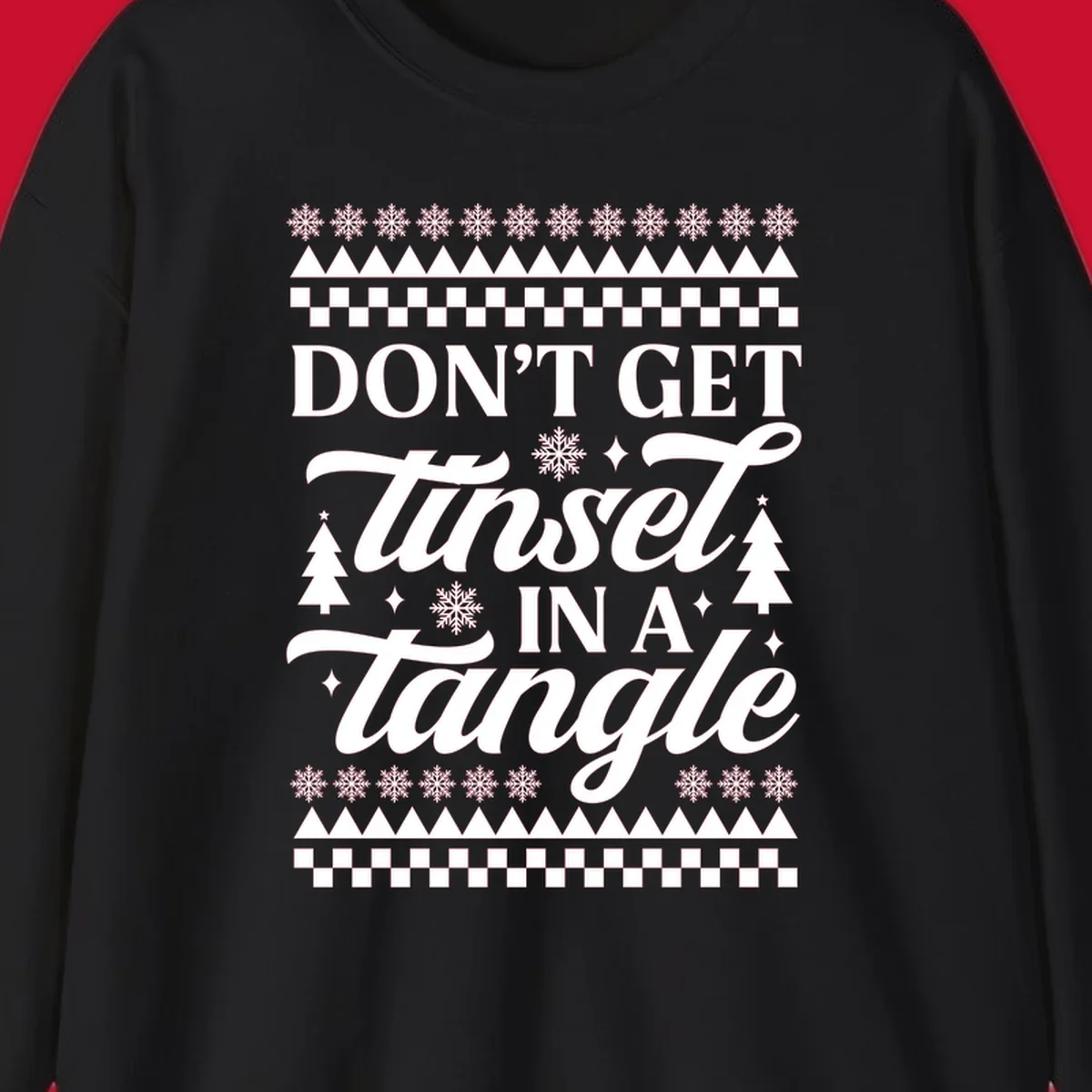Don't Get Tinsel In A Tangle holiday design with snowflakes and trees.