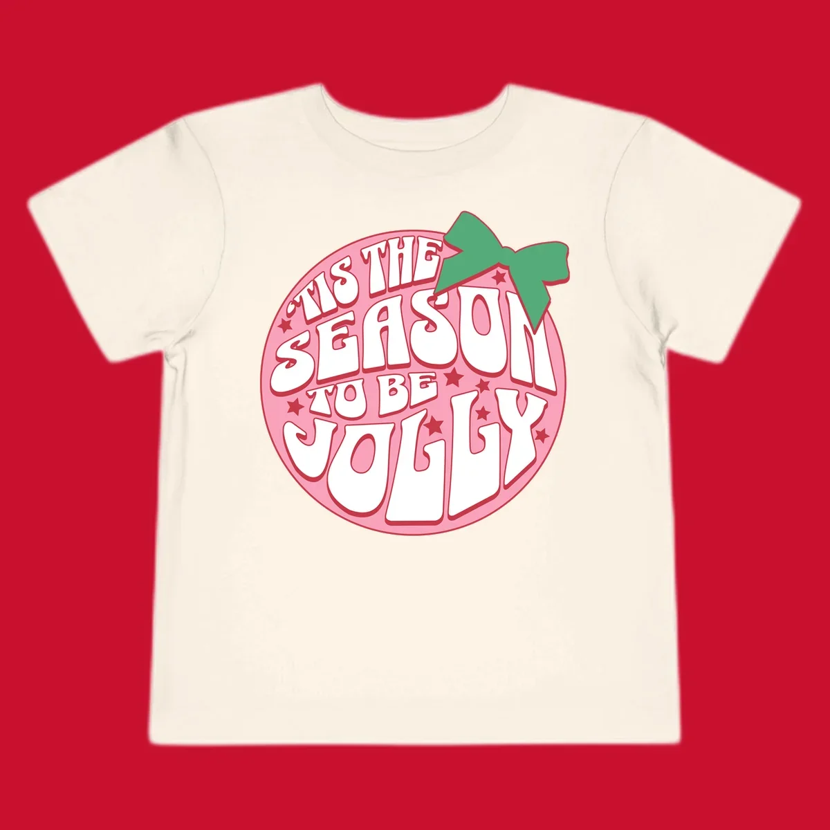 Tis the season to be jolly text with bow and stars, pink oval