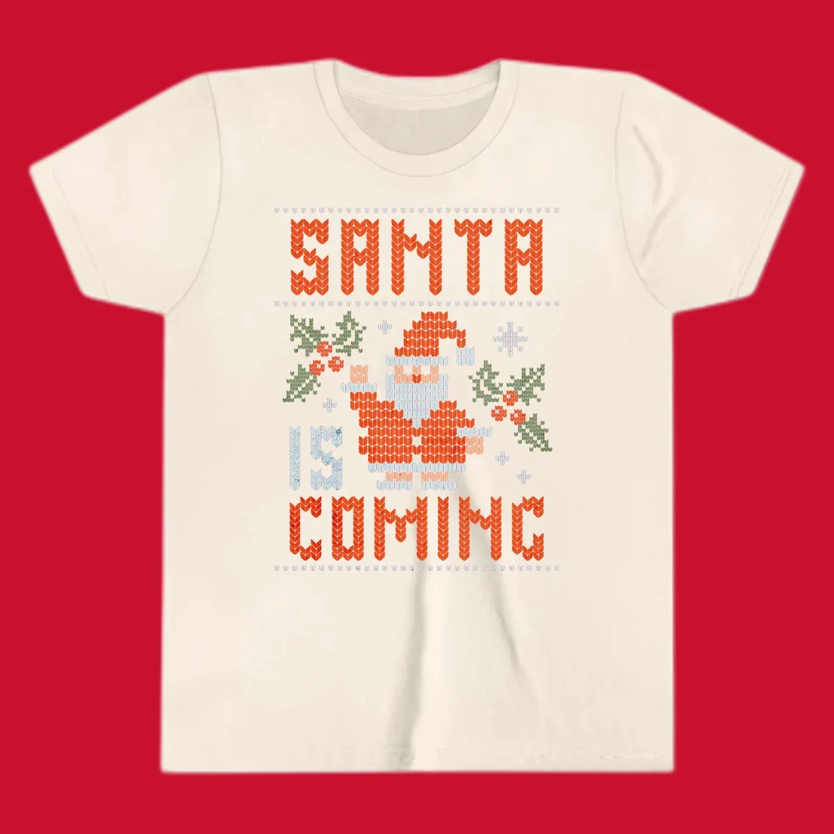 Santa is coming ugly Christmas sweater with pixelated Santa, holly, and snowflakes.