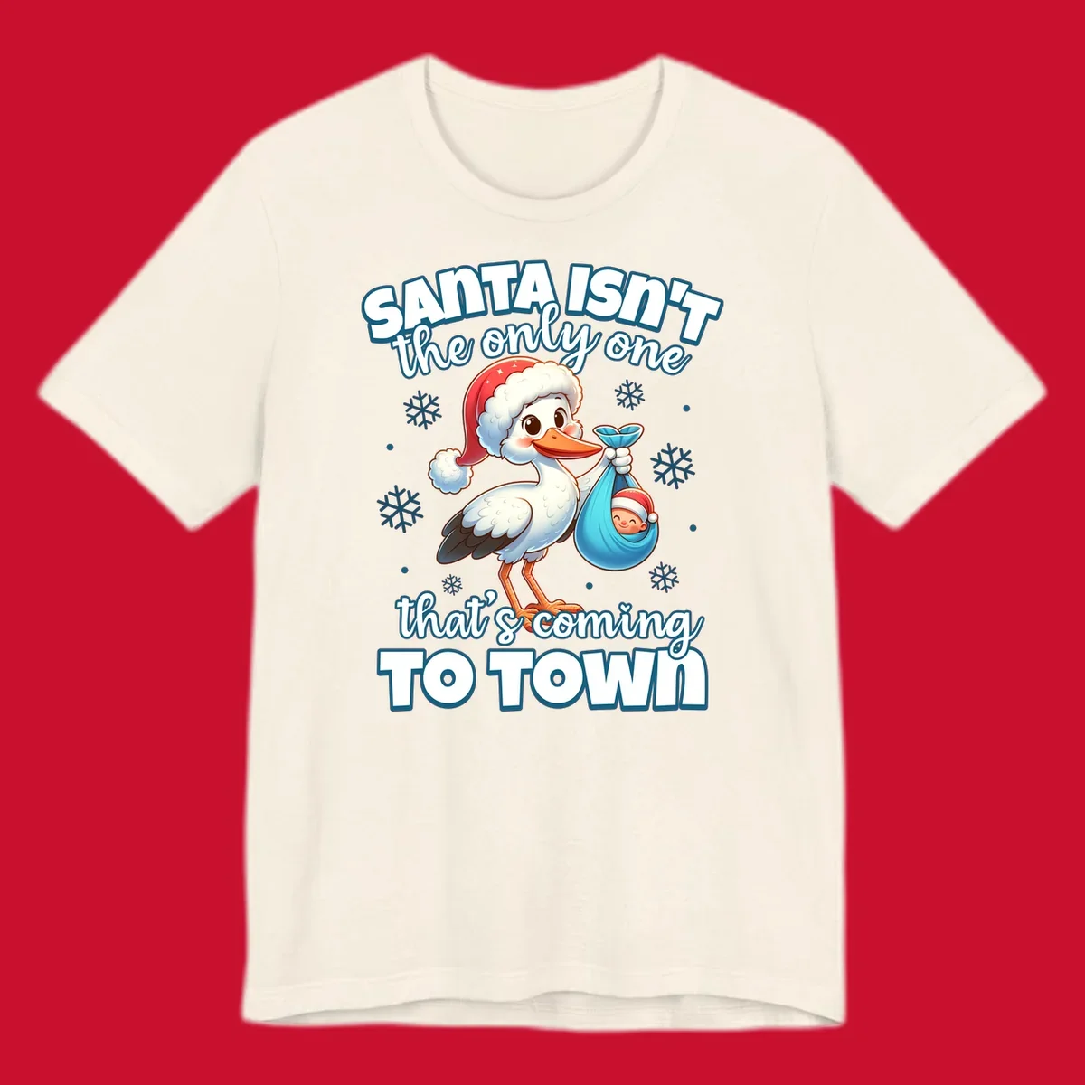 Stork carrying a baby with text "Santa Isn't The Only One That's Coming To Town".