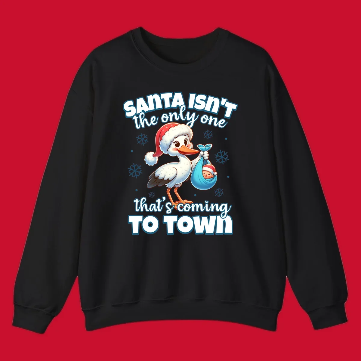 Stork carrying a baby with text "Santa Isn't The Only One That's Coming To Town".