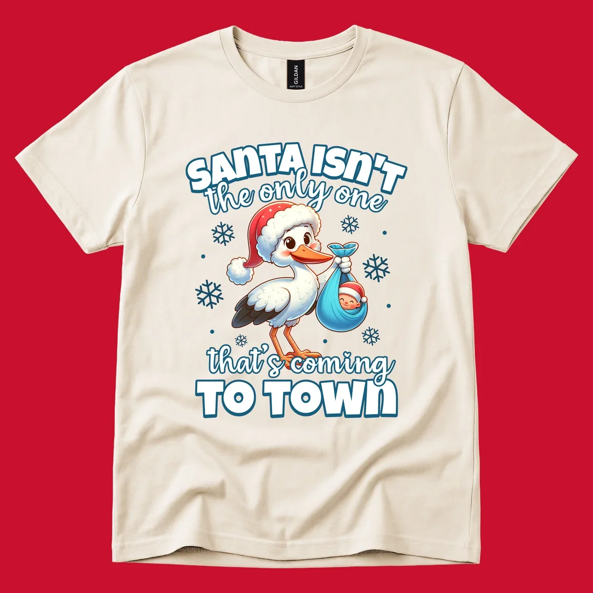 Stork carrying a baby with text "Santa Isn't The Only One That's Coming To Town".