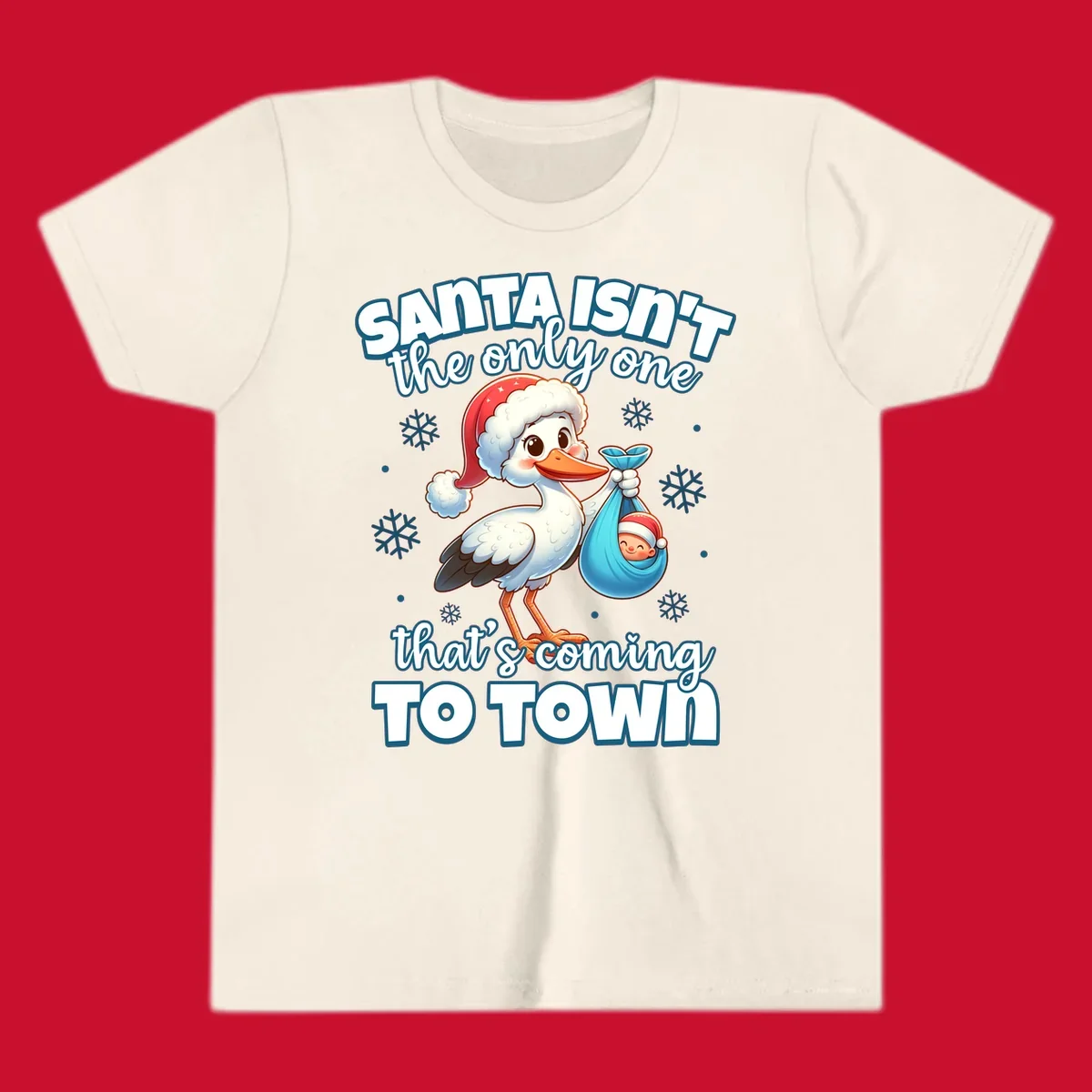 Stork carrying a baby with text "Santa Isn't The Only One That's Coming To Town".