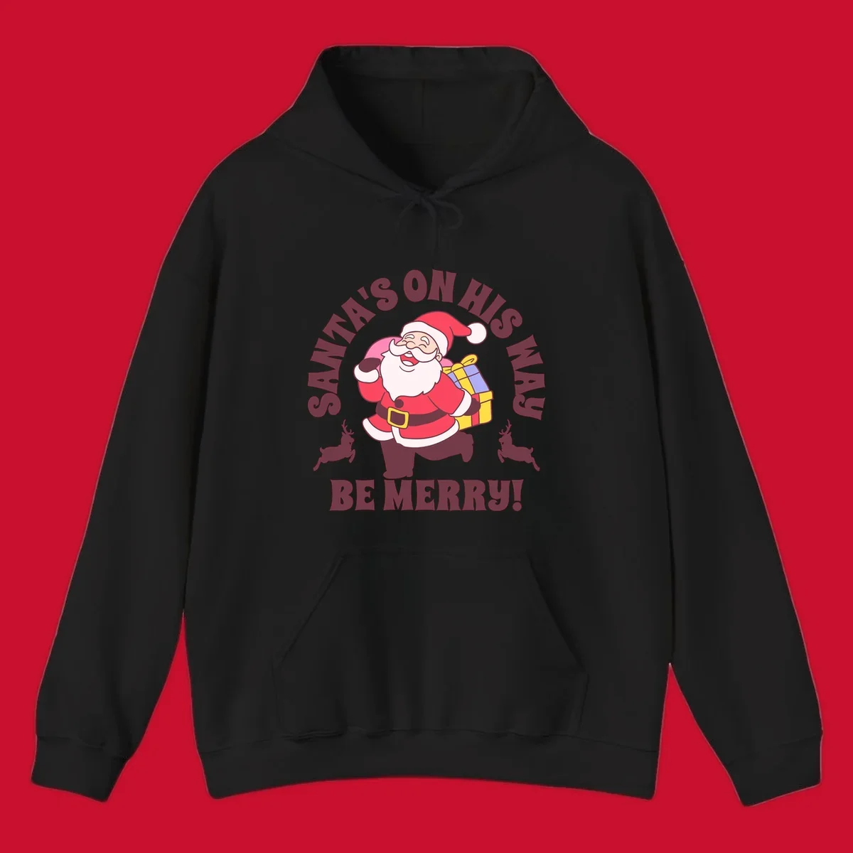 Illustration of Santa Claus running with gifts and reindeer, text reads Santa's on His Way Be Merry.