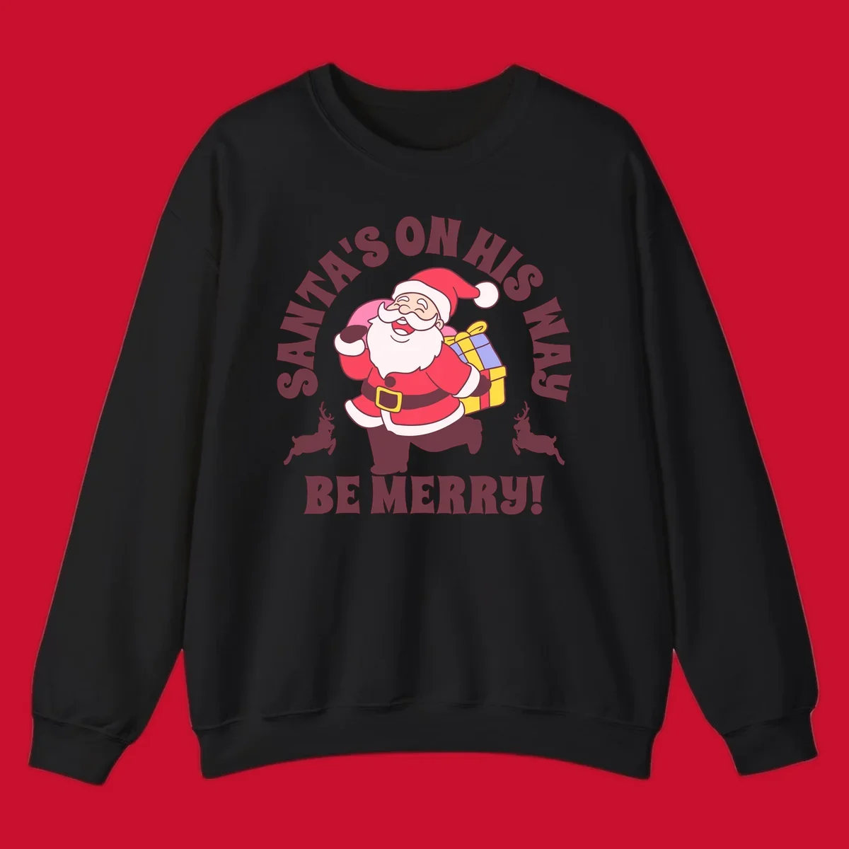 Illustration of Santa Claus running with gifts and reindeer, text reads Santa's on His Way Be Merry.