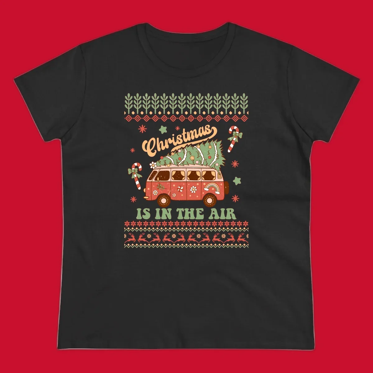 Retro Christmas van with tree on roof and 'Christmas IS IN THE AIR' text.