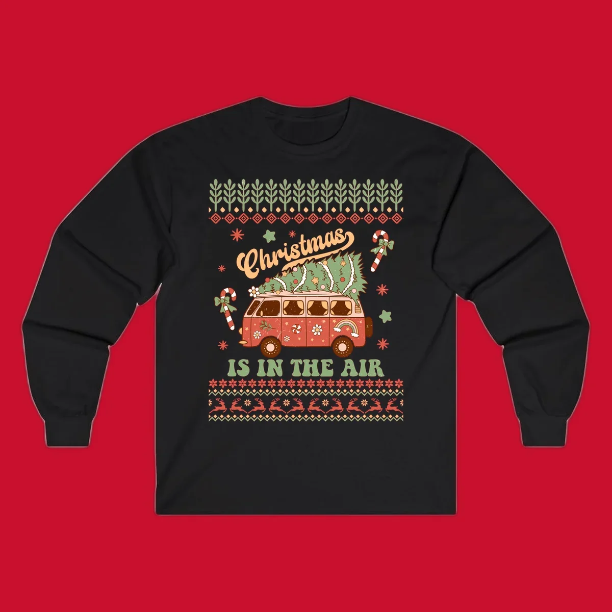 Retro Christmas van with tree on roof and 'Christmas IS IN THE AIR' text.