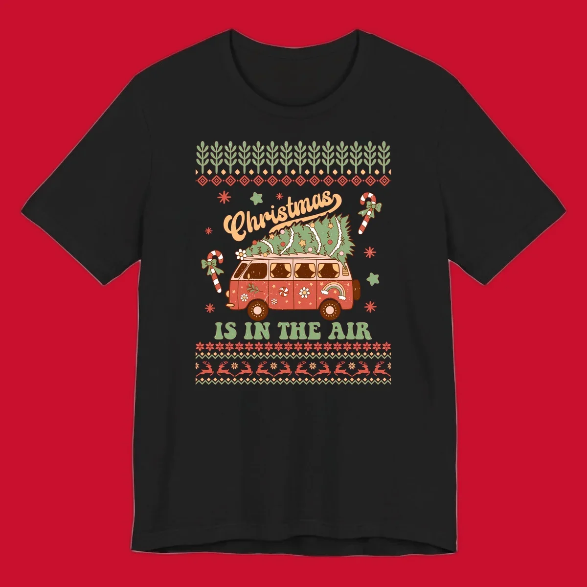 Retro Christmas van with tree on roof and 'Christmas IS IN THE AIR' text.
